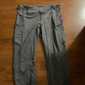 Gray cropped lululemon leggings with pockets on the size. Size 10.